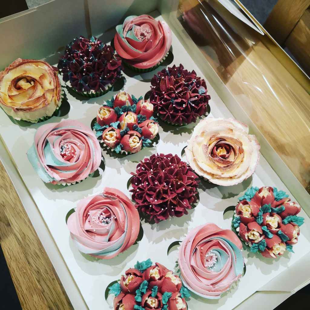 Set of delicious floral cupcakes in purple tones looking like real flowers - custom made by Embellished Food Art, Lower Hutt, Wellington cake decorating