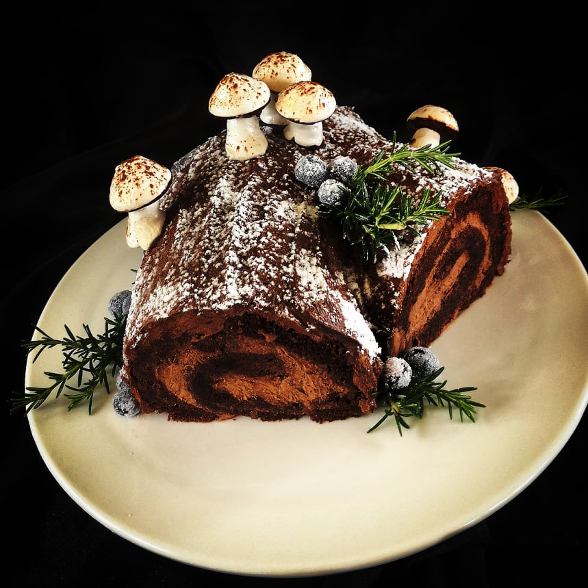 Chocolate Christmas log with chocolate buttercream, blueberries and handmade marshmallow and chocolate mushrooms - the best Christmas cake if you don't like fruitcake