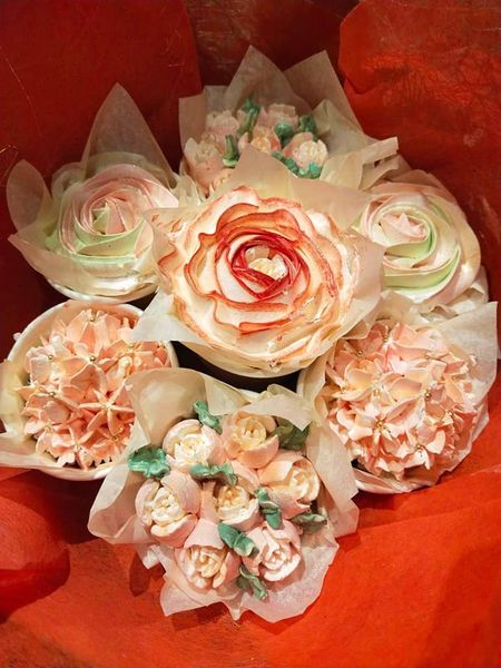 Delicious and beautiful floral cupcake bouquet for mother's day, set of individually decorated cupcakes each a different flower in shades of peach - custom made by Embellished Food Art, Lower Hutt, Wellington cake decorating