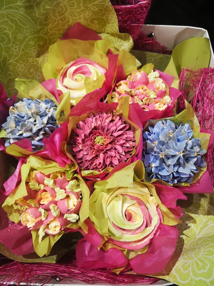 Floral cupcake bouquet for mother's day, set of individually decorated cupcakes each a different flower in shades of pink and blue