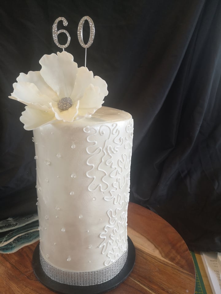 60th wedding anniversary cake in white fondant with hand sculpted sugar flower