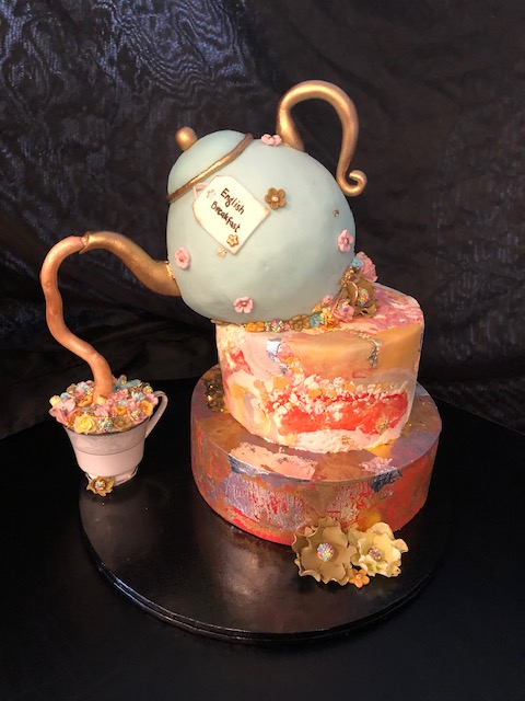 Gorgeous Teapot Cake, pouring fondant tea into a china cup of handmade flowers