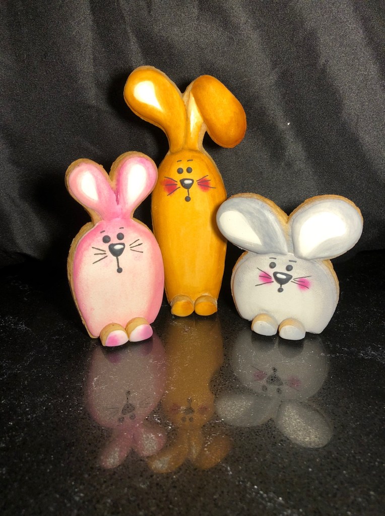 Trio of 3D standing bunnies cookies set yellow, pink and grey bunny - custom designed and made by Embellished Food Art, Lower Hutt, Wellington cake decorating