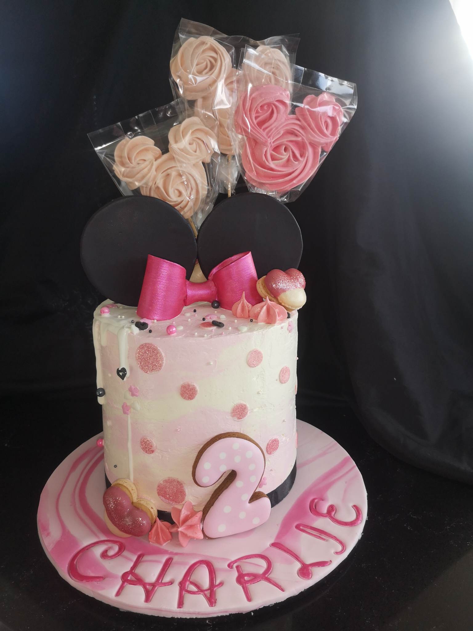 Minnie Mouse themed pink 2nd birthday cake Minnie ears, cookies and meringues