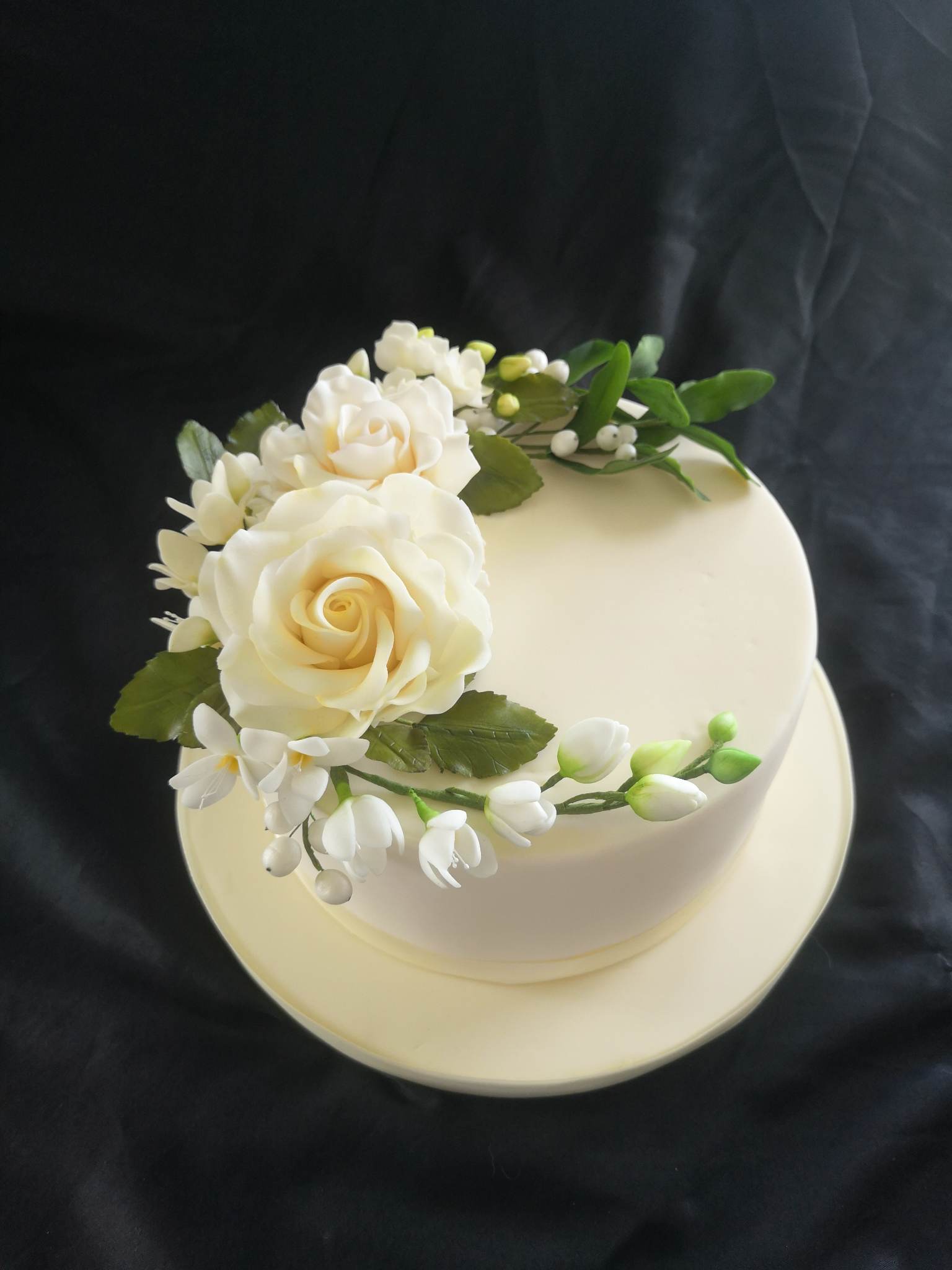 Stunning white fondant cake with hand made sugar flowers