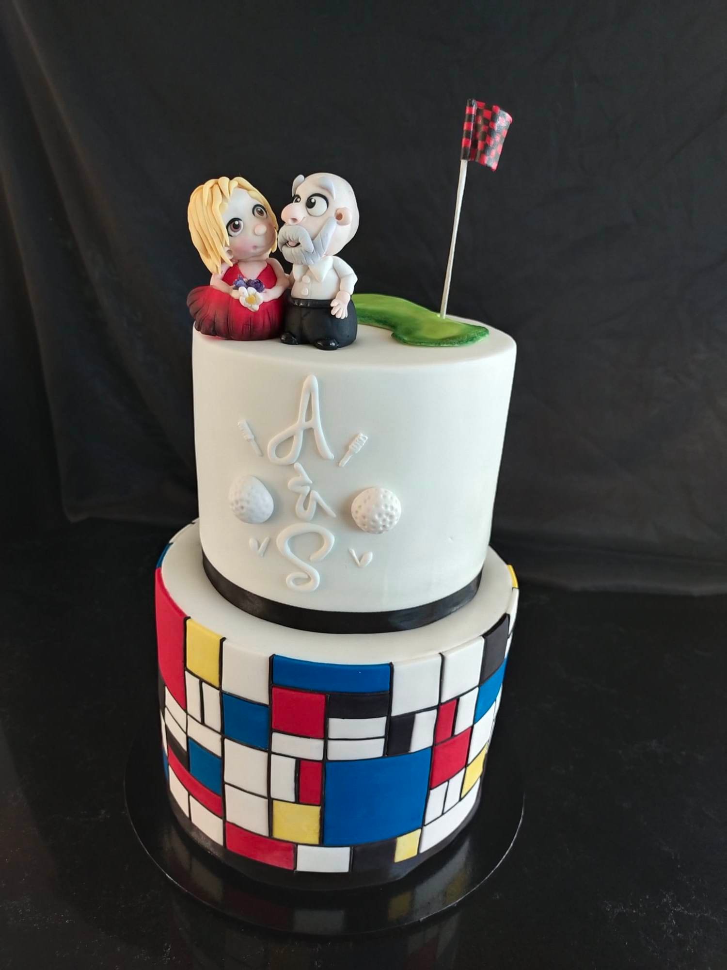 Custom made wedding cake with golf theme, hand made caricatures and Mondrian art base layer