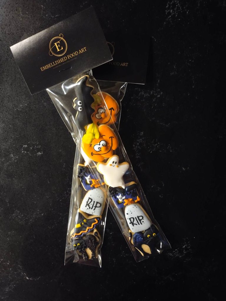 Halloween packaged bag of mini cookies with ghost, tombstone, pumpkin, bat, cat - designed and custom made by Embellished Food Art, Lower Hutt, Wellington cake decorating