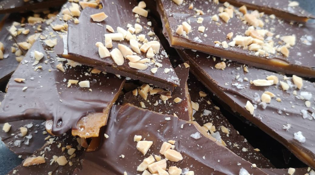 Delicious dark toffee bark with almonds and salt crystals